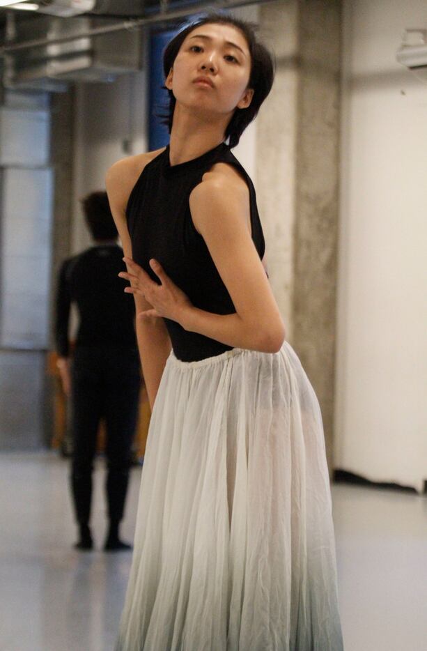 Beijing Dance Theater company members Feng Linshu, foreground, and Zheng Jie rehearse Beyond...