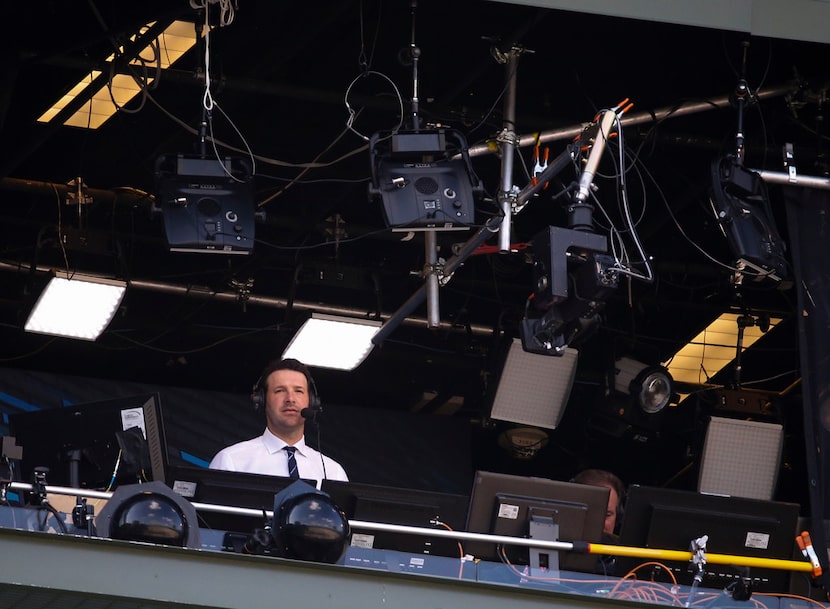 Tony Romo in the broadcast booth during the first half of an NFL football game between the...