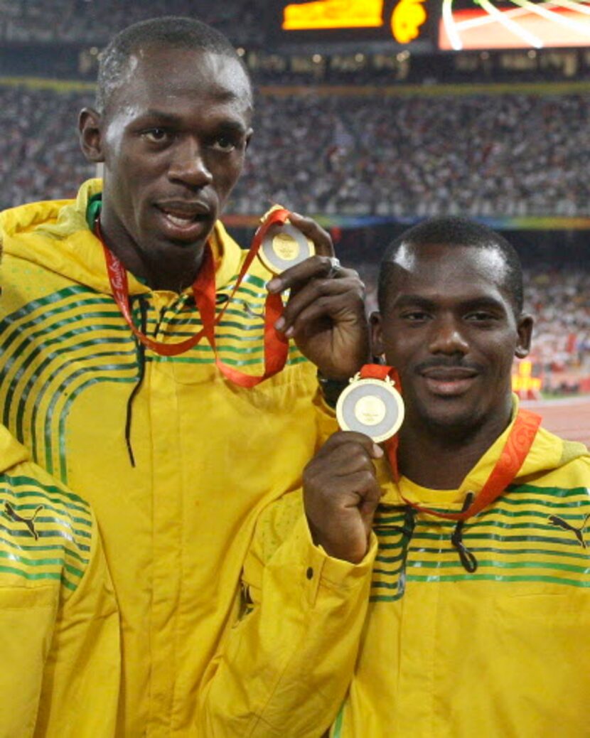 Usain Bolt (izq.) junto a Nesta Carter en los Olímpicos de 2008 (AP Photo/Petr David Josek,...