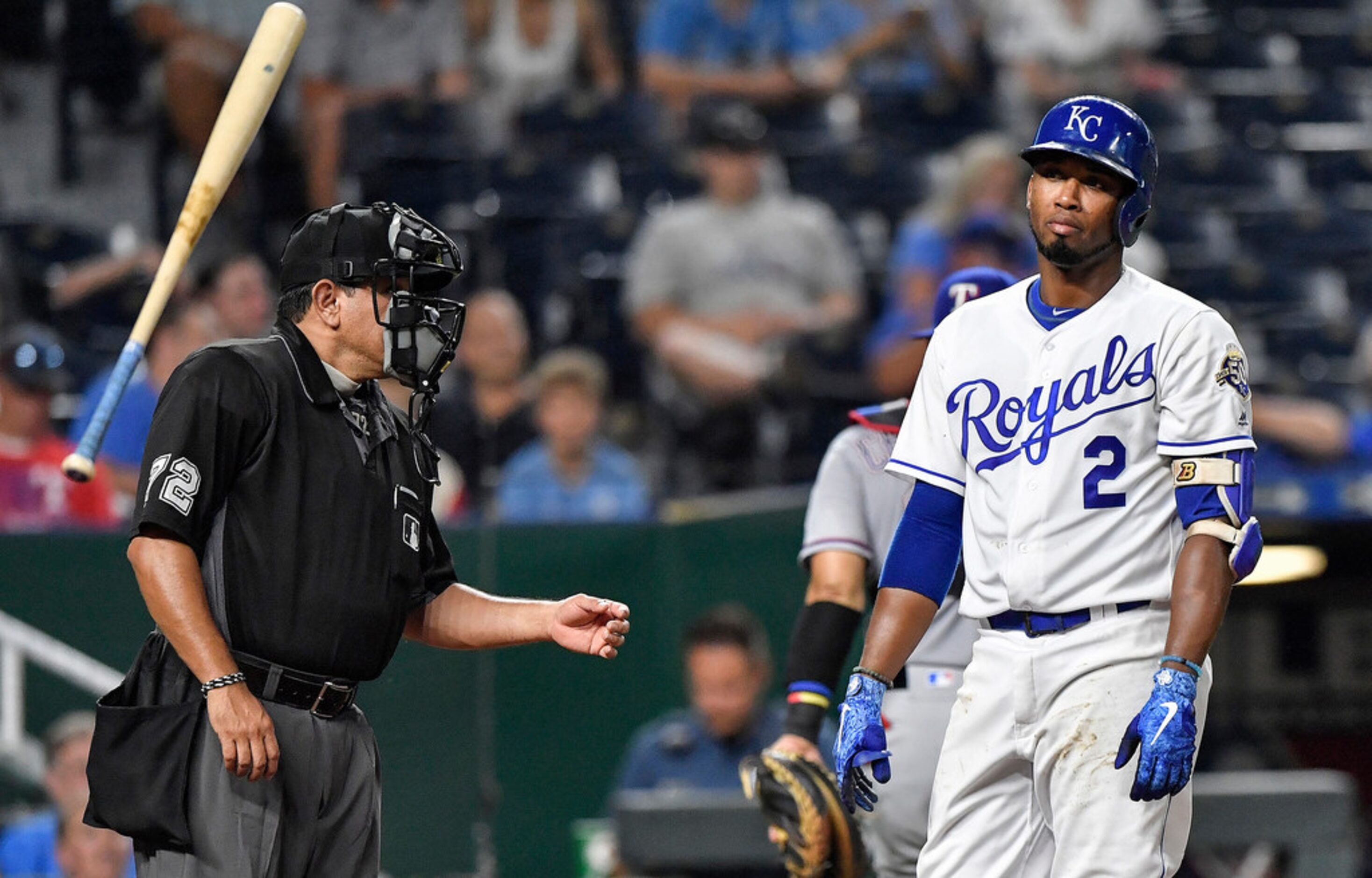 Kansas City Royals' Alcides Escobar tosses his bat after striking out to end the eighth...