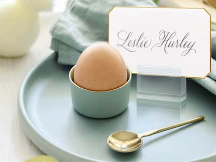 Gold-tipped place card on blue brunch plate