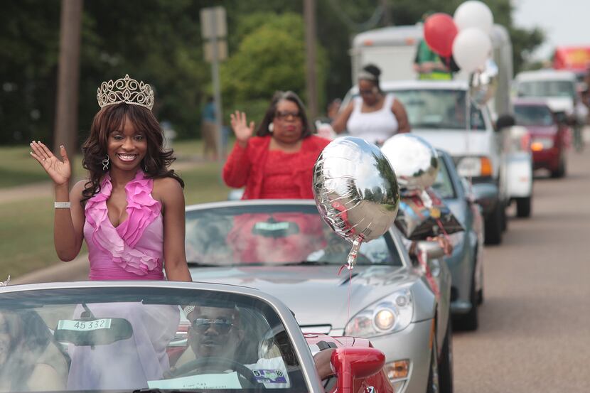 Nicole Barrett, who won Miss Black Texas in 2002, rode in the Juneteenth Fest Parade through...
