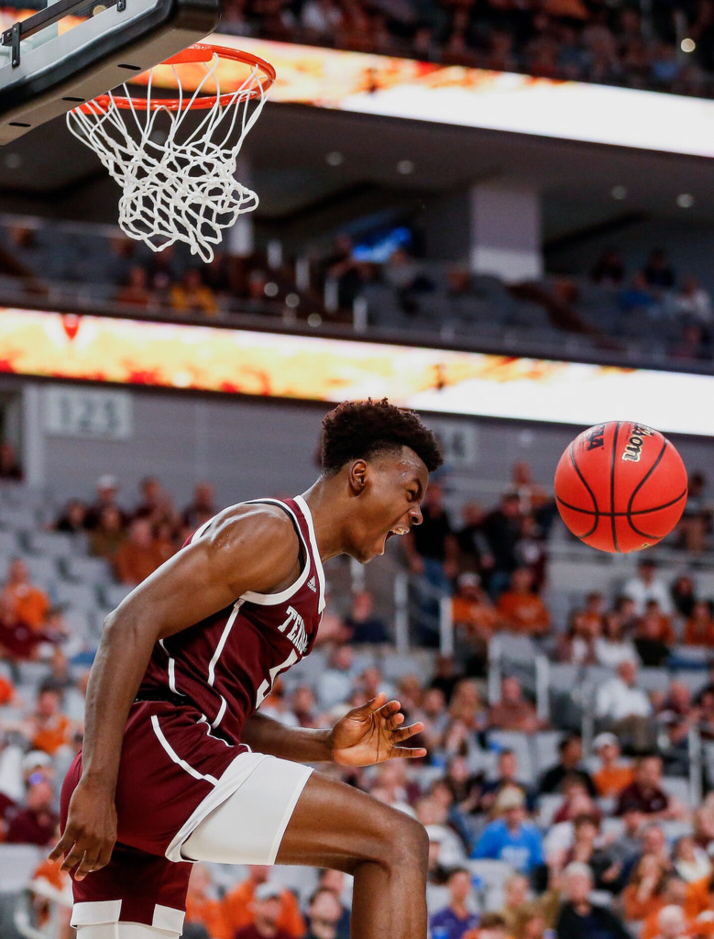 Texas A&M Aggies forward Emanuel Miller (5) scores during the second half of a basketball...