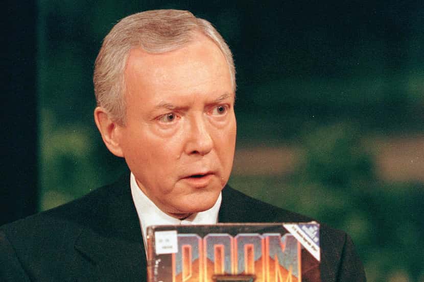 Sen. Orrin Hatch, R-Utah, holds a copy of the popular computer game 'Doom' during a...