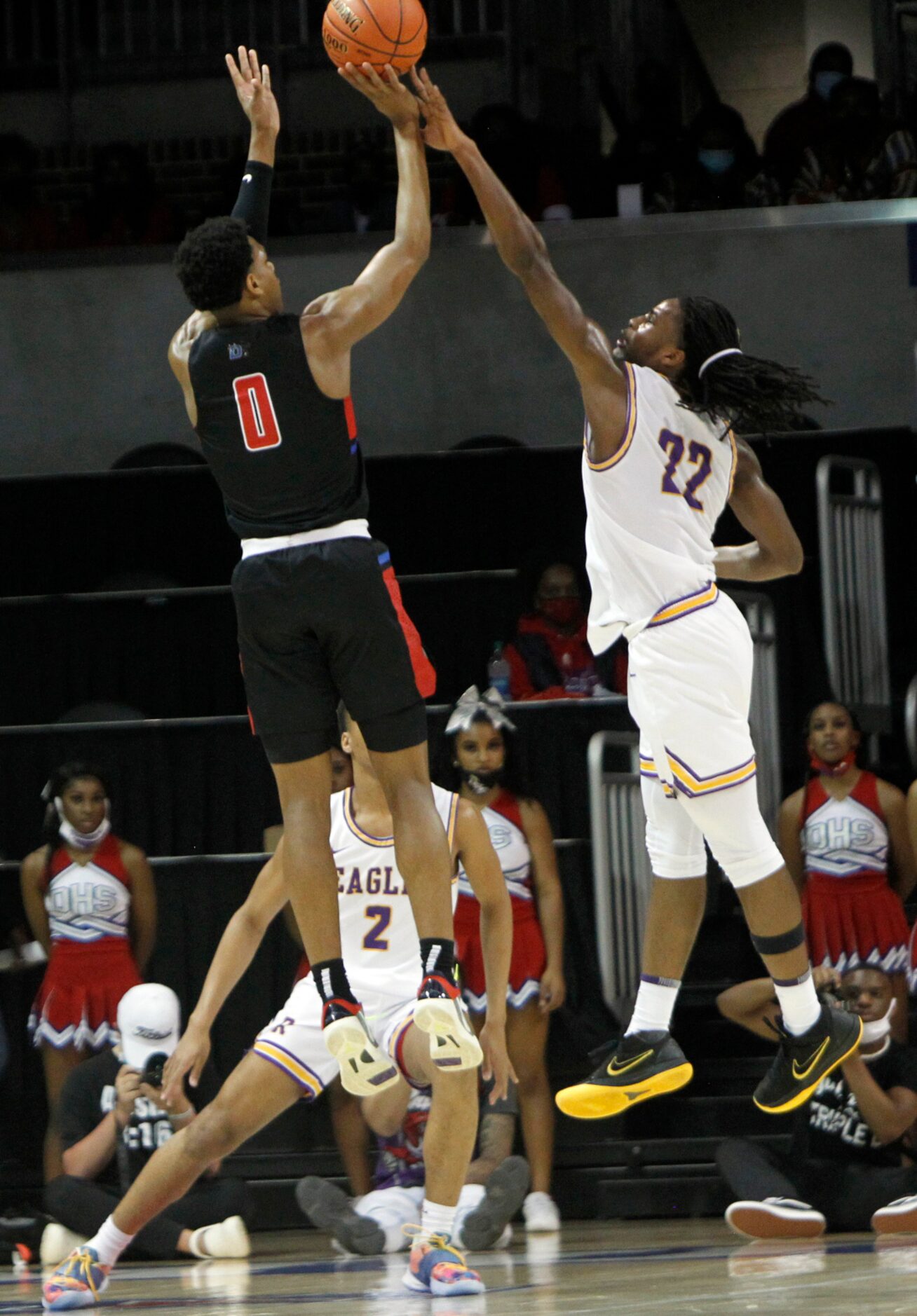 Duncanville guard Zhuric Phelps (0) skies as he gets off a jump shot to the tight defense of...