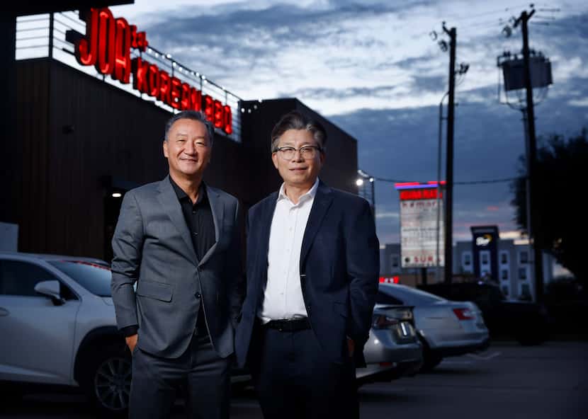John Lee (left) and Hyun Kyum Kim, two members of the Korean American Chamber of Commerce,...