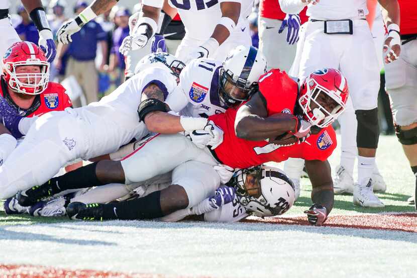 MEMPHIS, TN - DECEMBER 30: Running back Sony Michel #1 of the Georgia Bulldogs falls into...