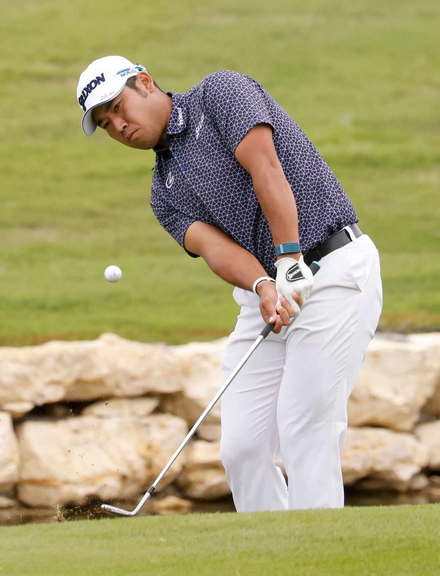 Hideki Matsuyama hits on the green on the 18th hole during round 2 of the AT&T Byron Nelson ...