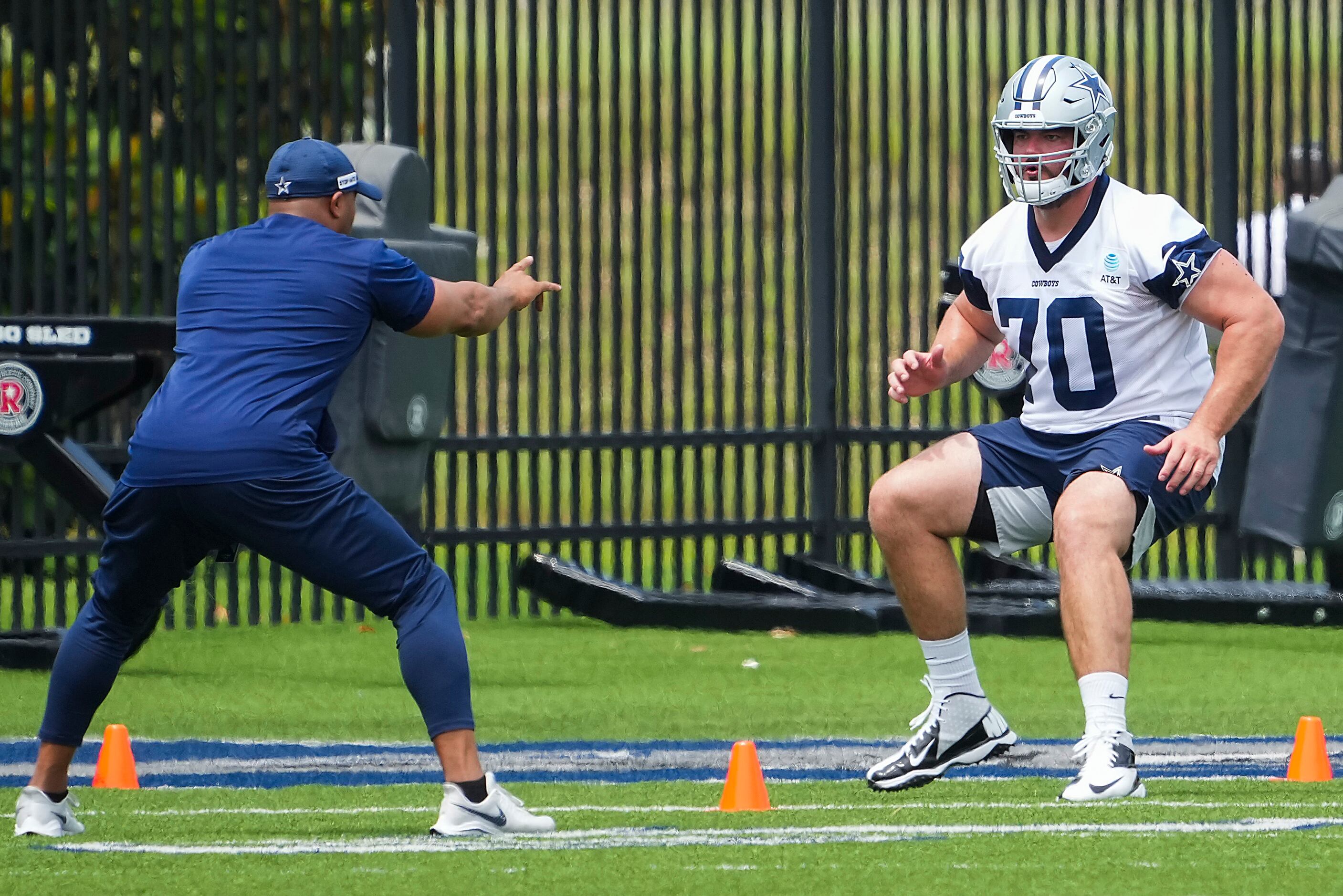Dallas Cowboys guard Zack Martin runs a conditioning drill during a minicamp practice at The...