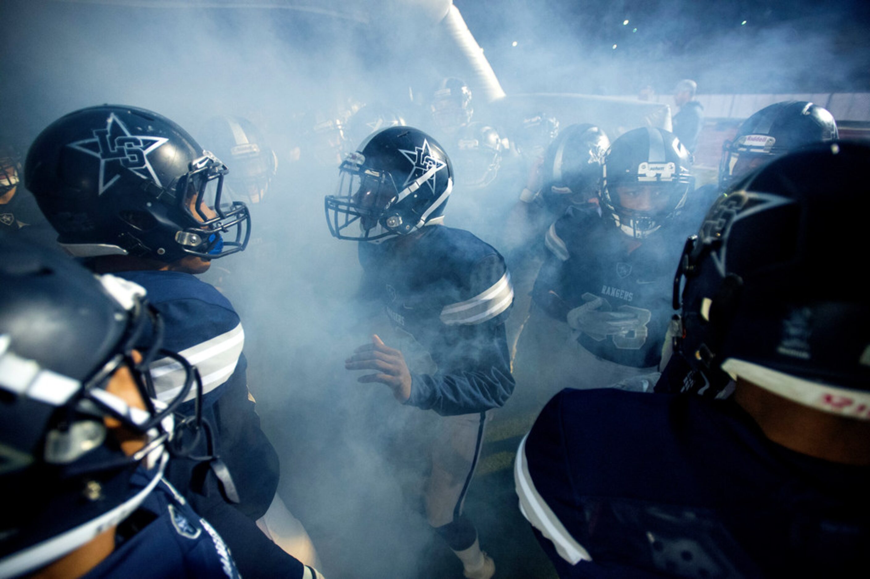 Frisco Lone Star junior wide receiver Marvin Mims (18) pumps up his teammates before a...