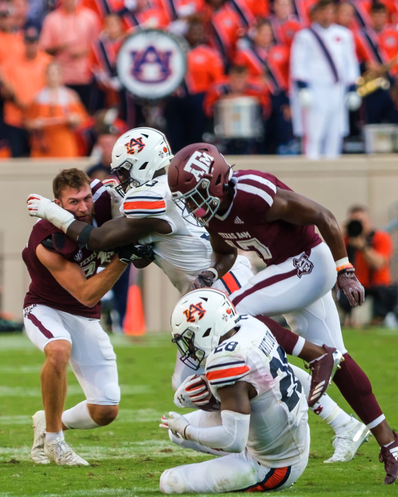 Auburn running back JaTarvious Whitlow (28) recovers an onside kick as Texas A&M wide...