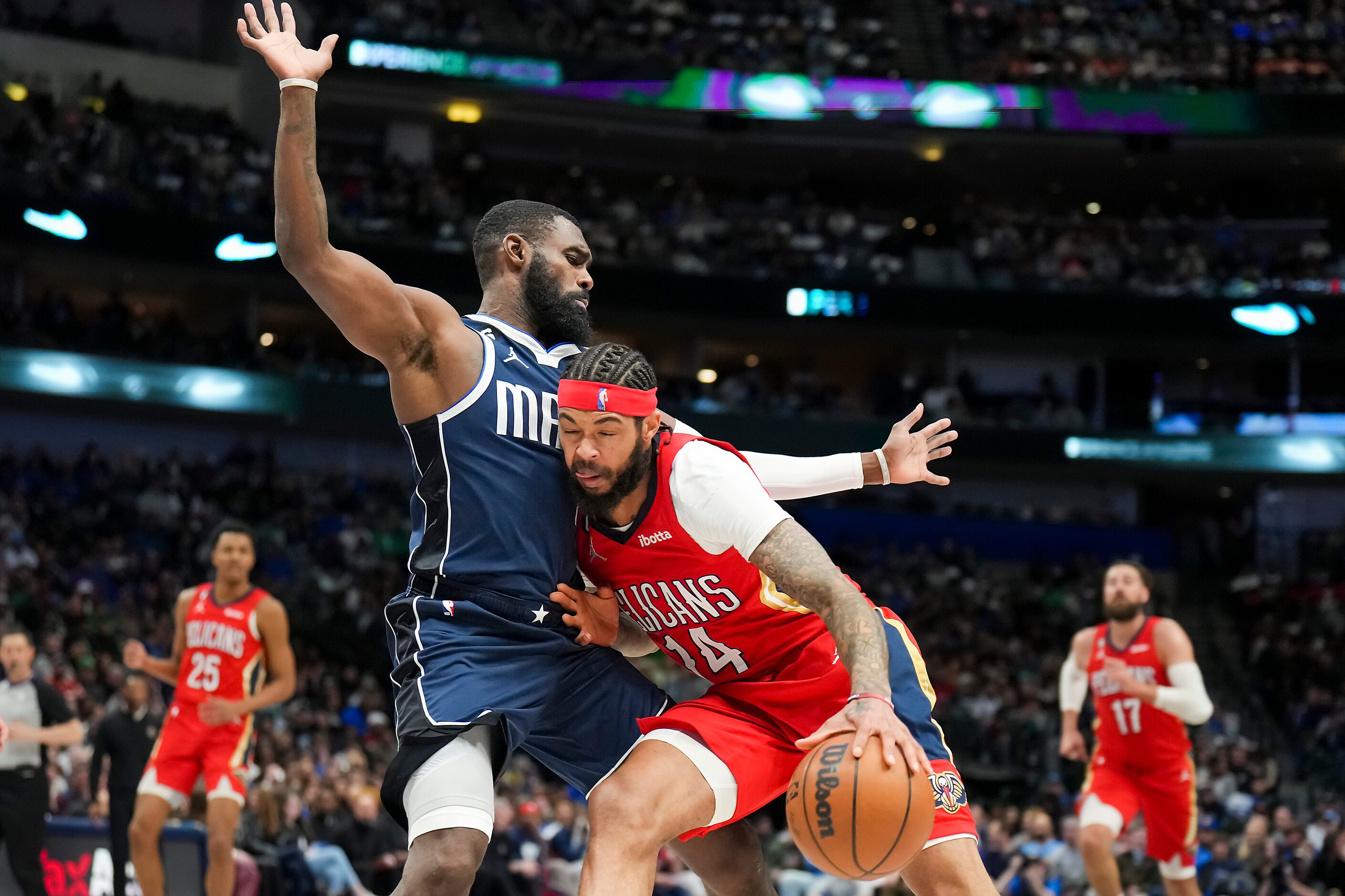 Dallas Mavericks forward Tim Hardaway Jr. (11) defends against New Orleans Pelicans forward...