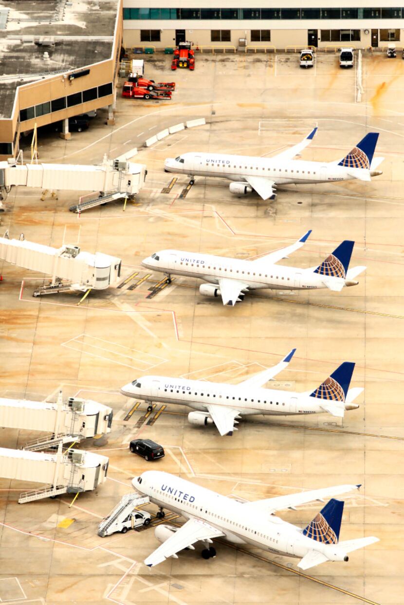 United Airlines idled planes at George Bush Intercontinental Airport in Houston. (Tom...