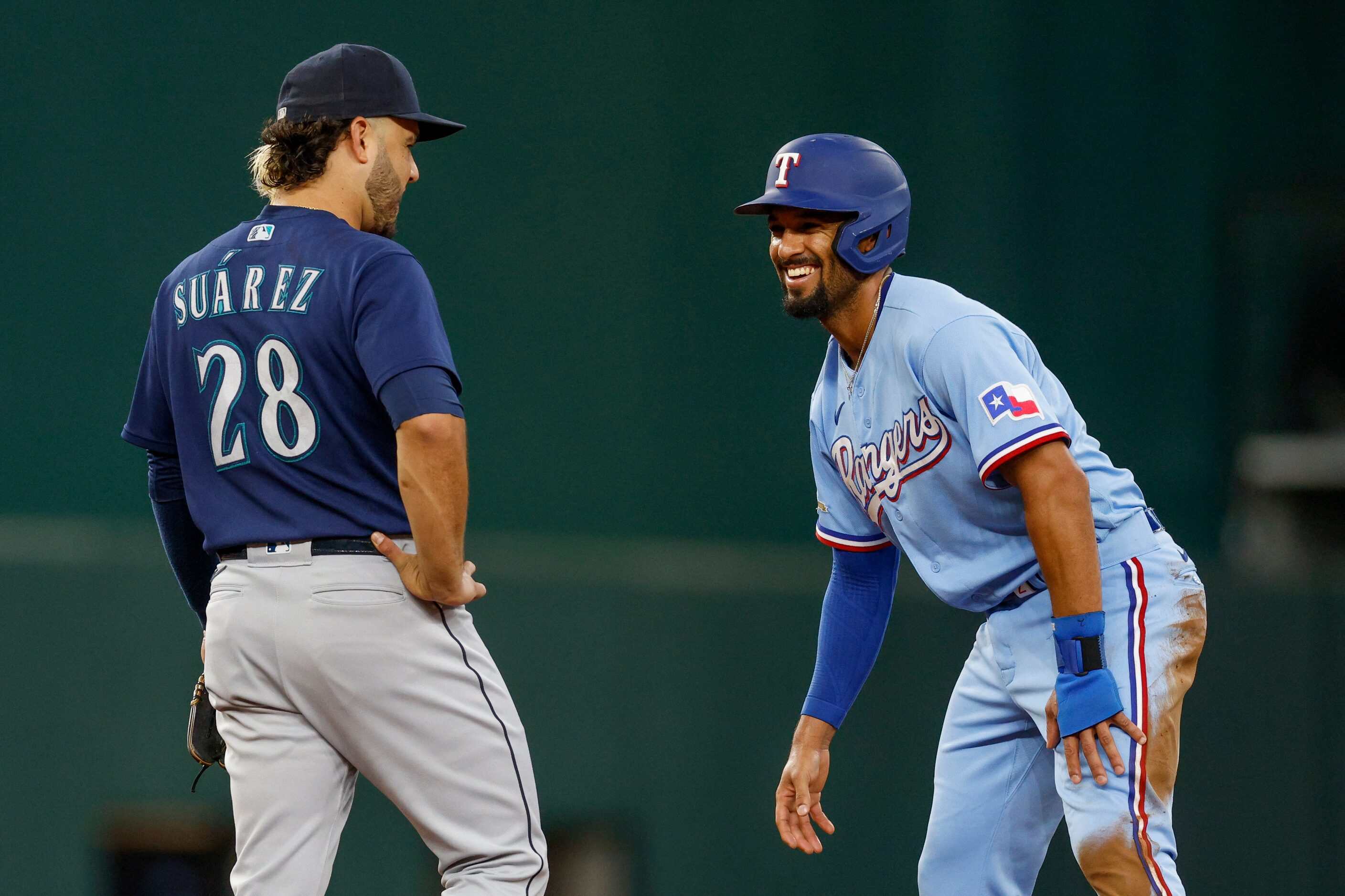 Texas Rangers second baseman Marcus Semien (2) smiles at Seattle Mariners third baseman...