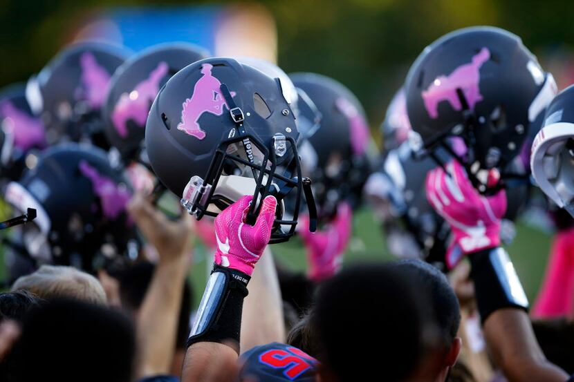 The Southern Methodist Mustangs football players will pay with pink ponies on their helmets...