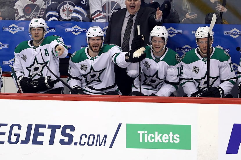 Dallas Stars coach Ken Hitchcock and player Tyler Seguin (91) yell at officials during the...
