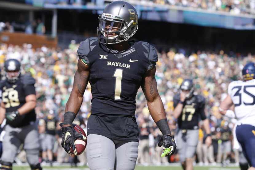 Baylor wide receiver Corey Coleman (1) looks toward the end zone after scoring against West...