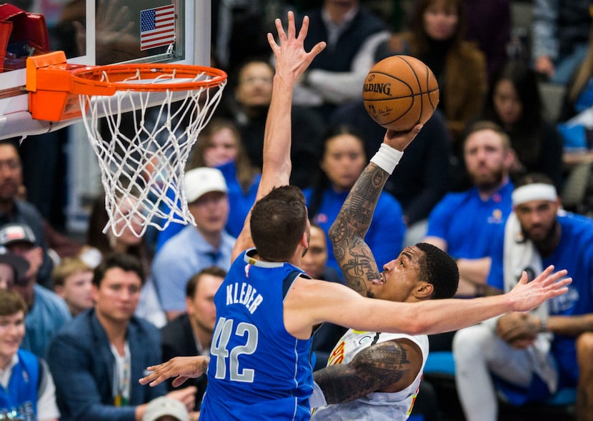 Dallas Mavericks forward Maxi Kleber (42) tries to stop a shot by Atlanta Hawks forward John...