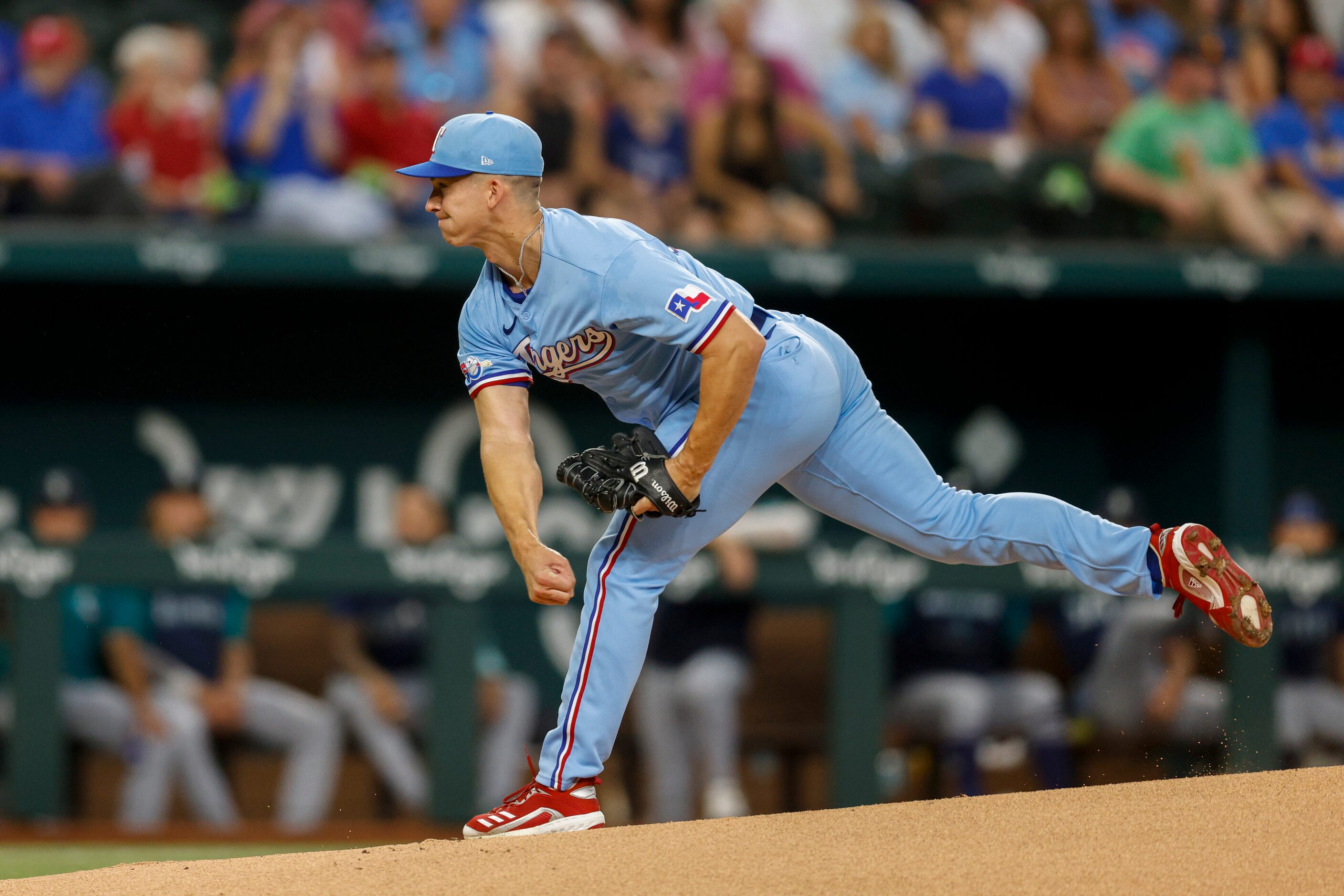 Texas Rangers starting pitcher Glenn Otto (49) delivers a pitch during the first inning of a...