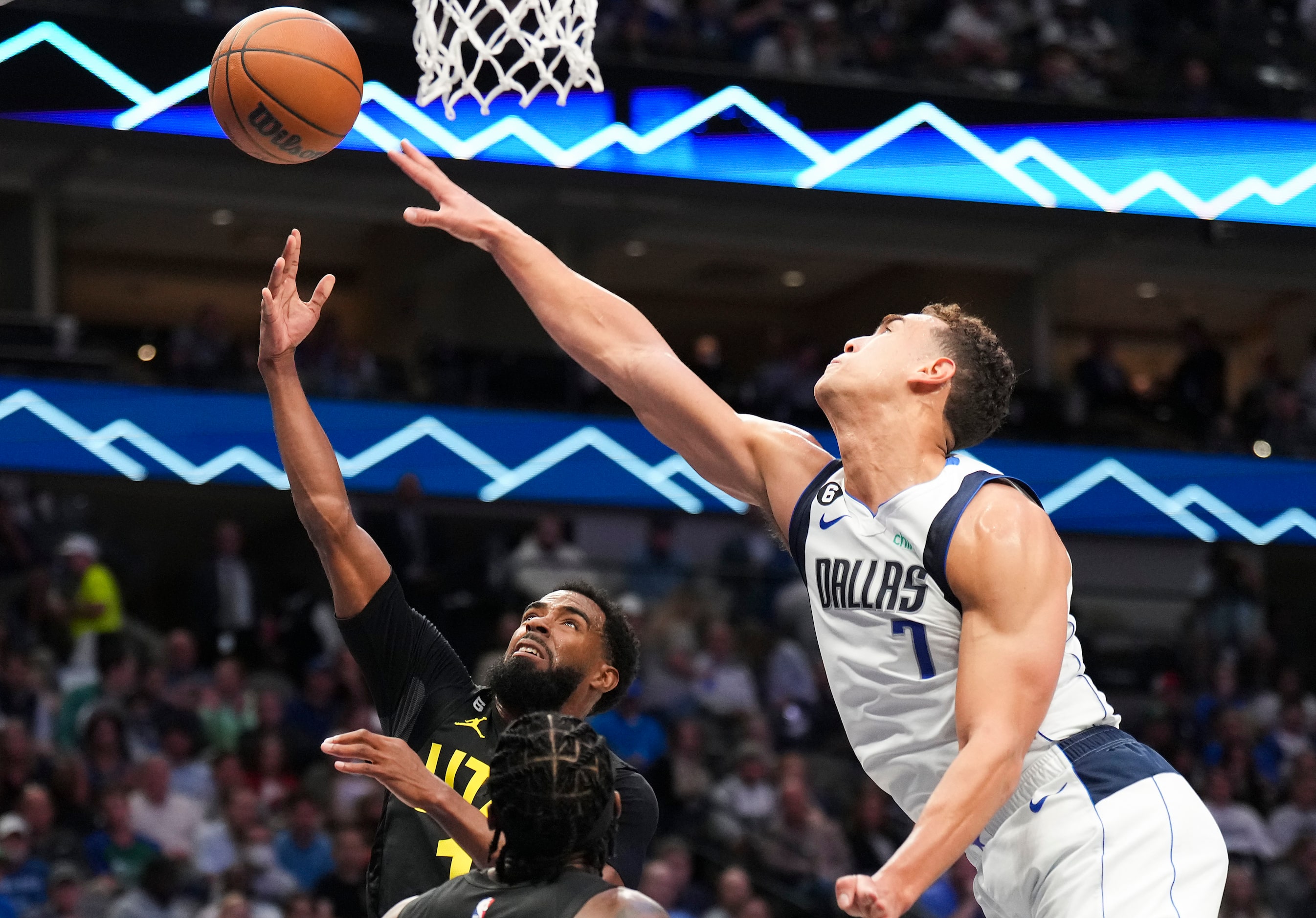 Dallas Mavericks center Dwight Powell (7) defends a shot by Utah Jazz guard Mike Conley (11)...