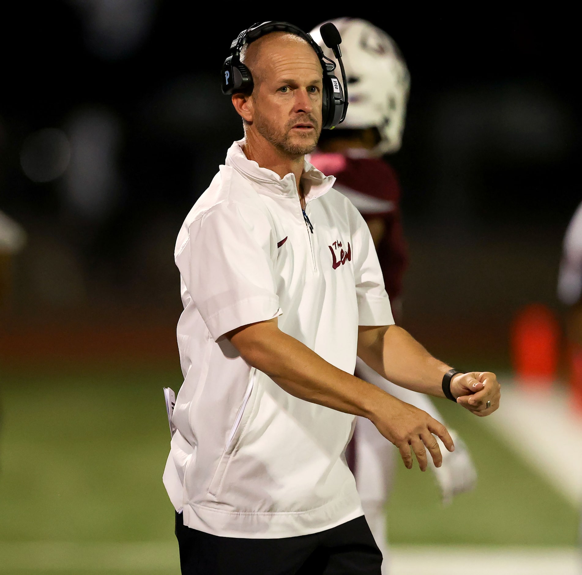 Lewisville head coach Michael Odle calls a play on the sideline against Denton Braswell in a...