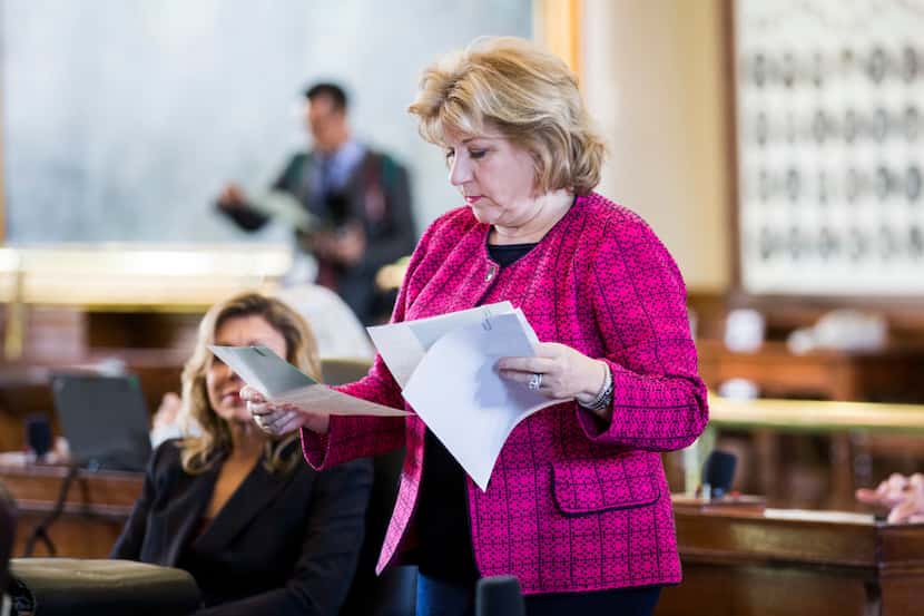 Senator Jane Nelson looks over documents on the second day of the 86th Texas legislature on...
