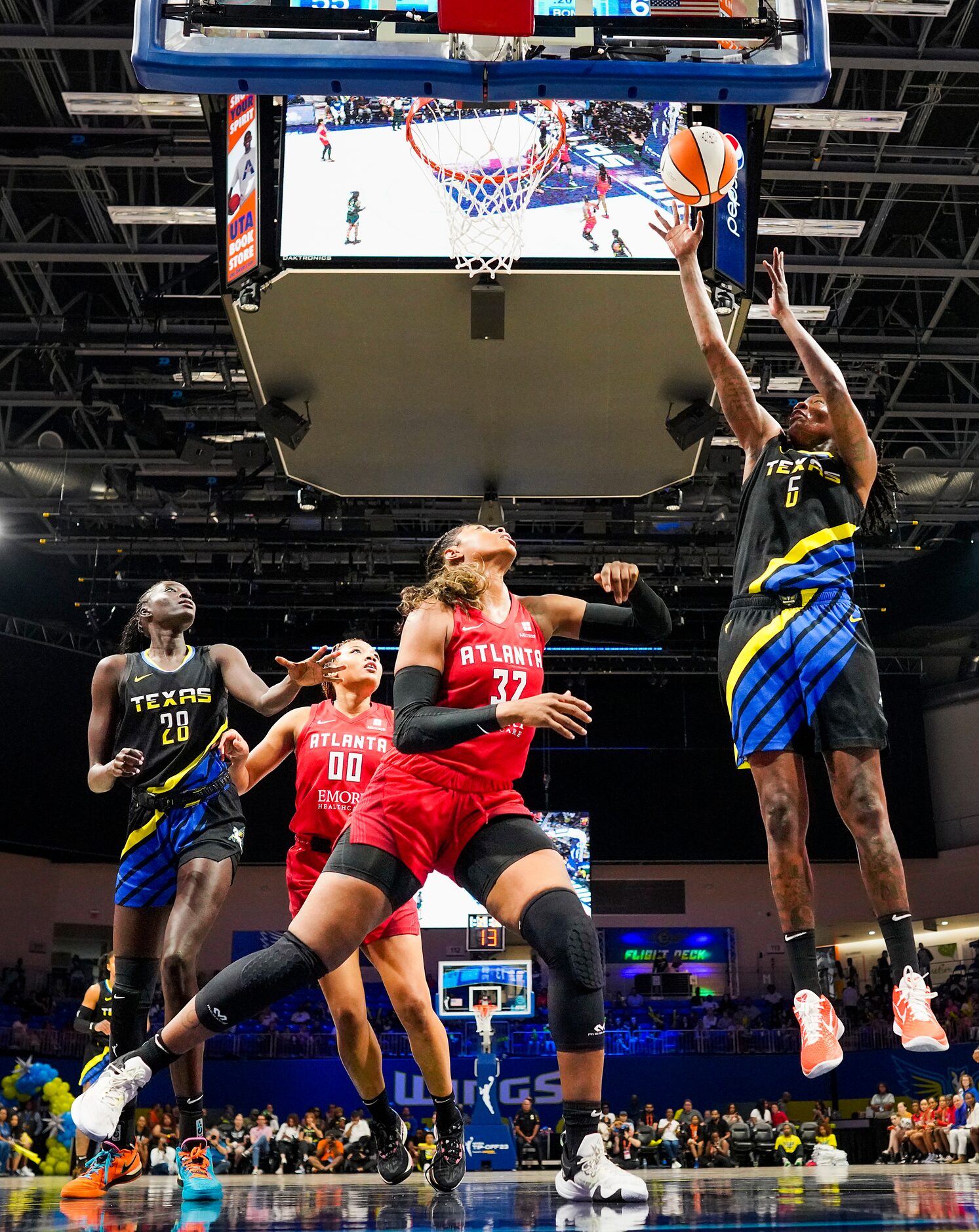 Dallas Wings forward Natasha Howard (6) shoots over Atlanta Dream forward Cheyenne Parker...