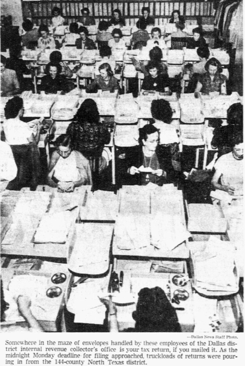 IRS workers surrounded by income tax letters submitted by deadline in 1952.