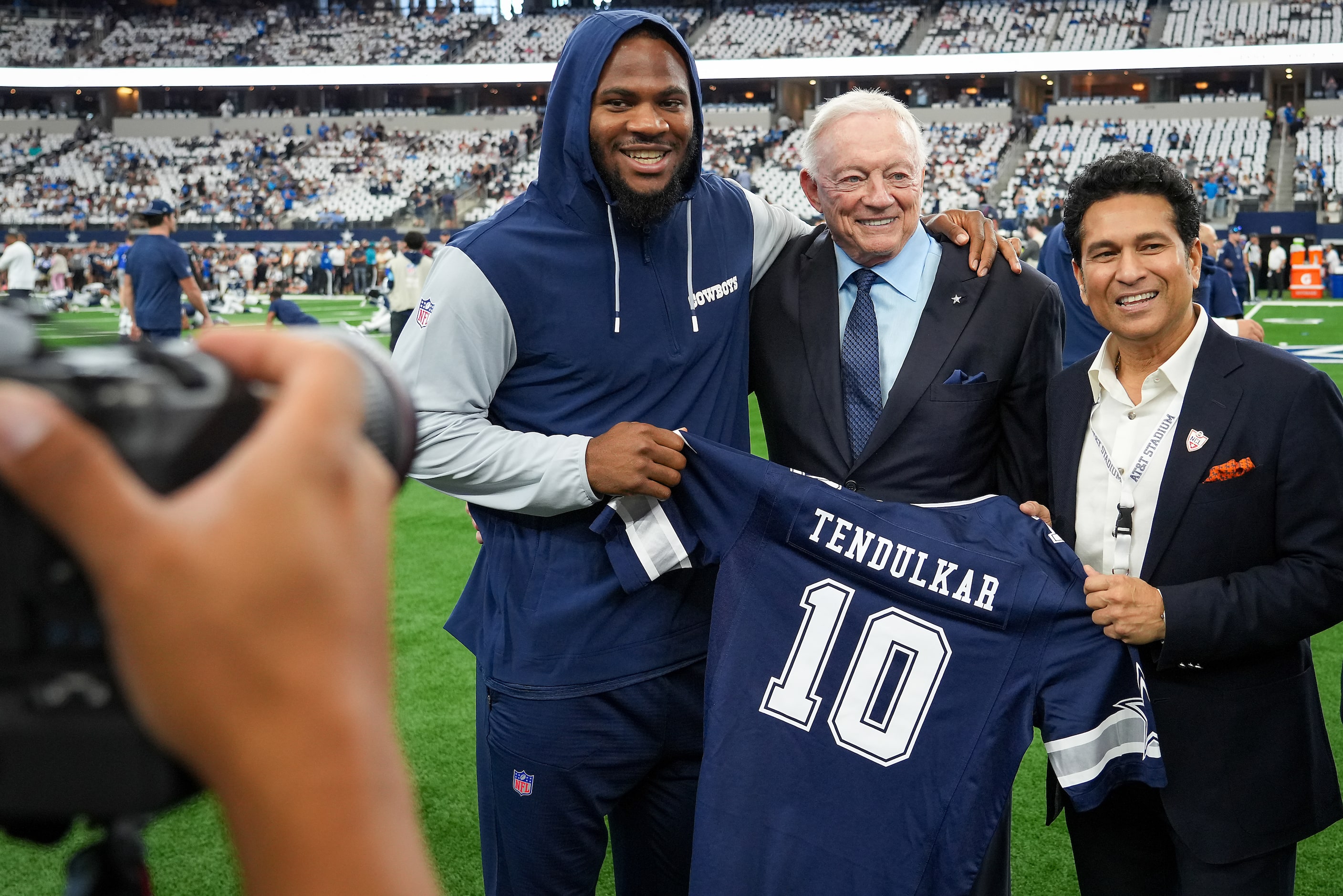 Cricket legend Sachin Tendulkar (right) poses for a photos with Dallas Cowboys linebacker...