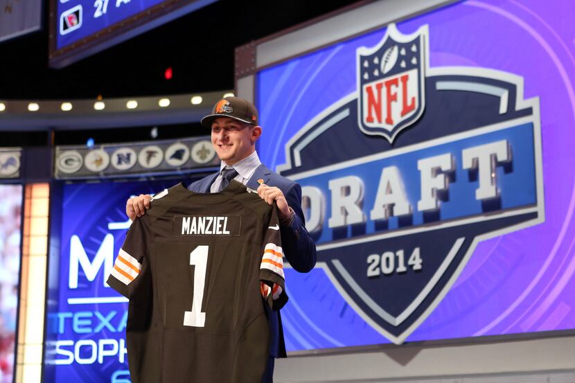 May 8, 2014; New York, NY, USA; Johnny Manziel (Texas A&M) poses with a jersey after being...