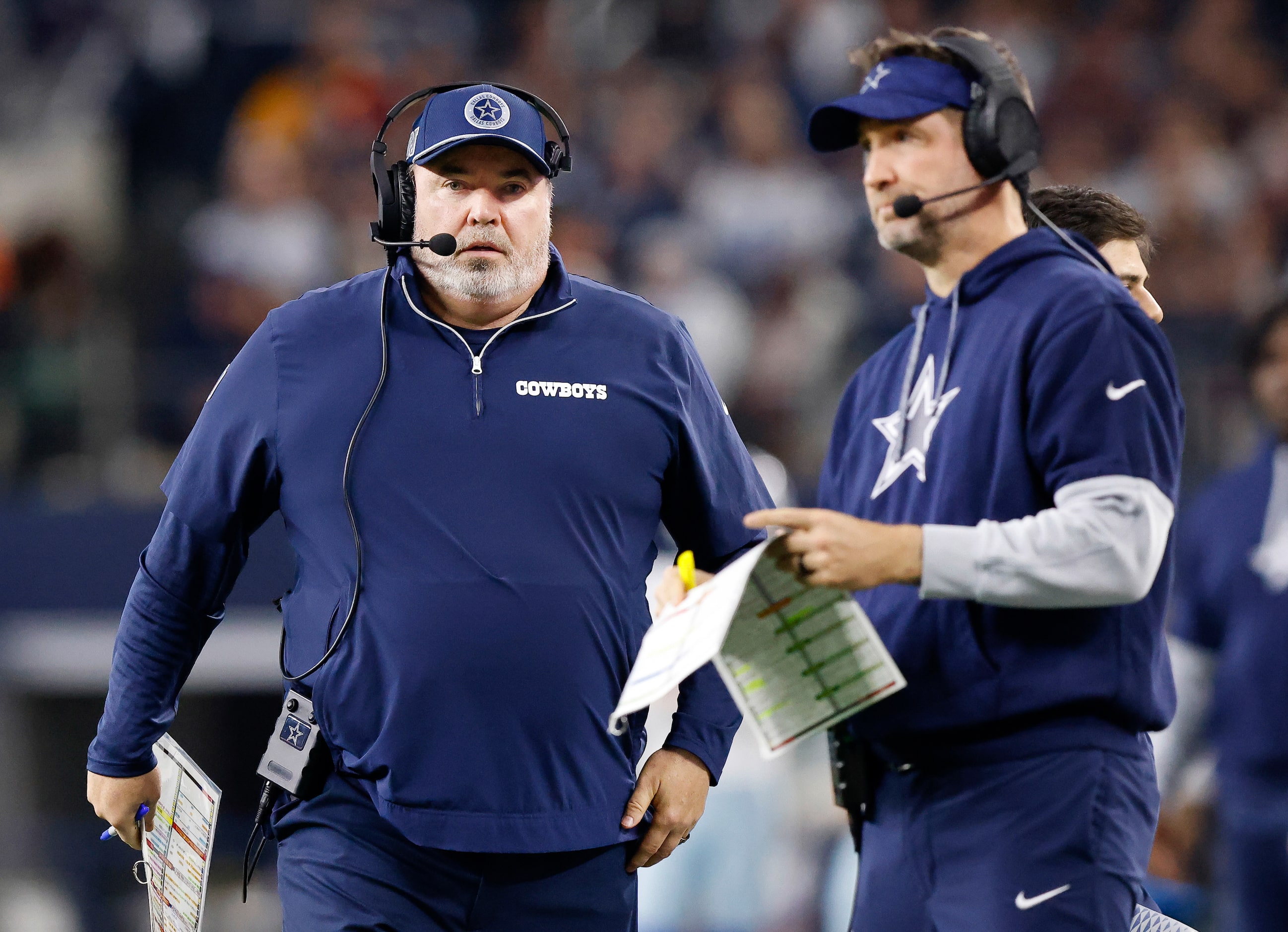 Dallas Cowboys head coach Mike McCarthy marches down the field toward offensive coordinator...