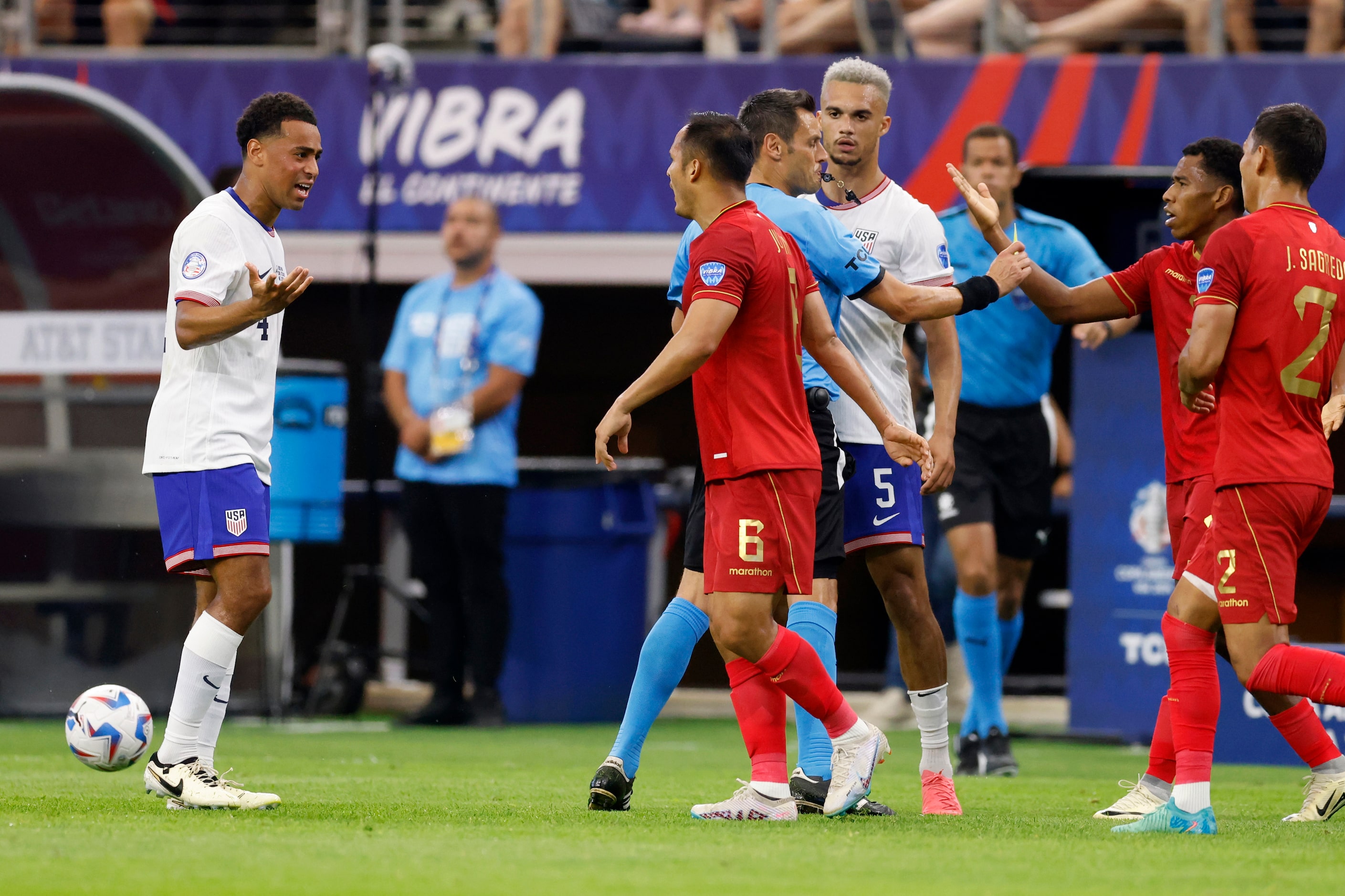 United States midfielder Tyler Adams (4) and Bolivia midfielder Leonel Justiniano (6)...