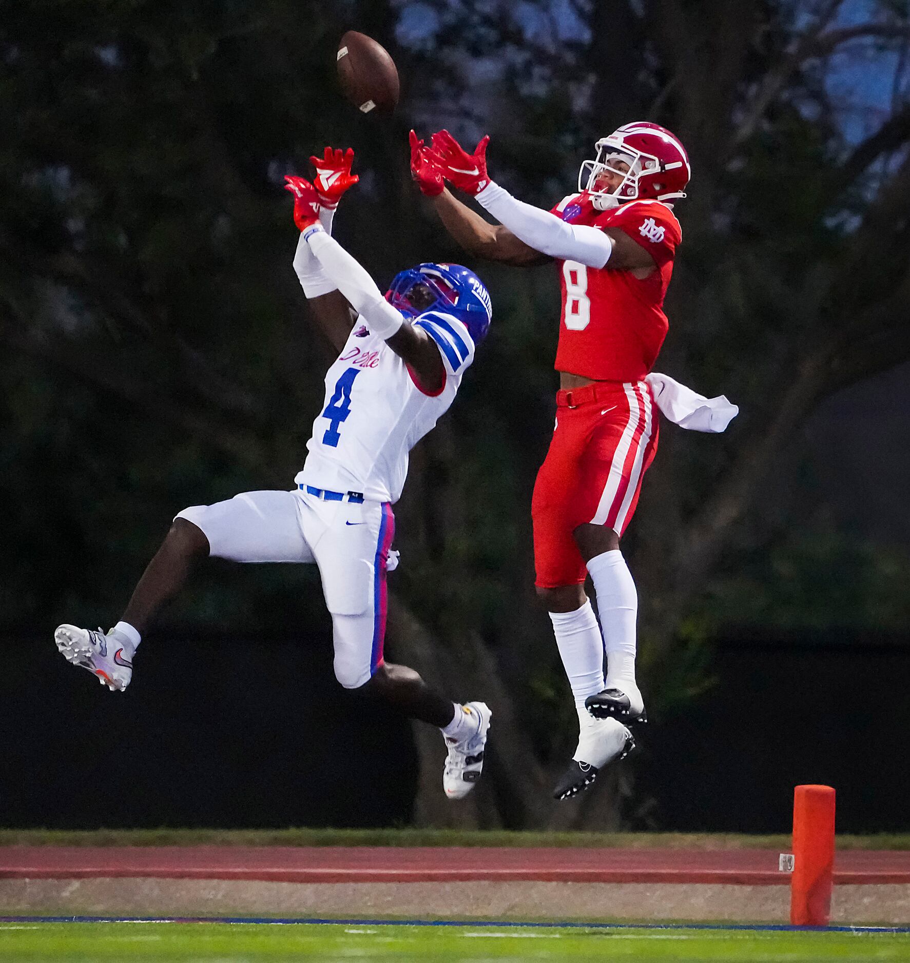 Duncanville defensive back Deldrick Madison (4) breaks up a pass in the end zone intended or...