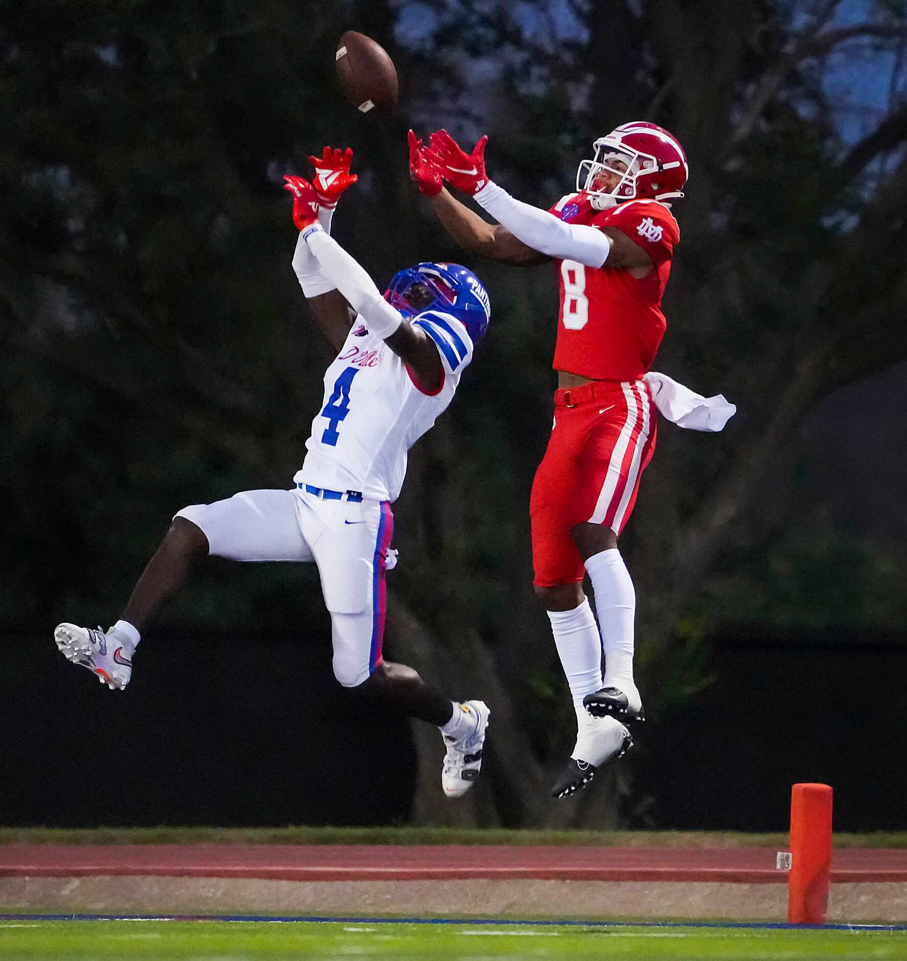 Duncanville defensive back Deldrick Madison (4) breaks up a pass in the end zone intended or...