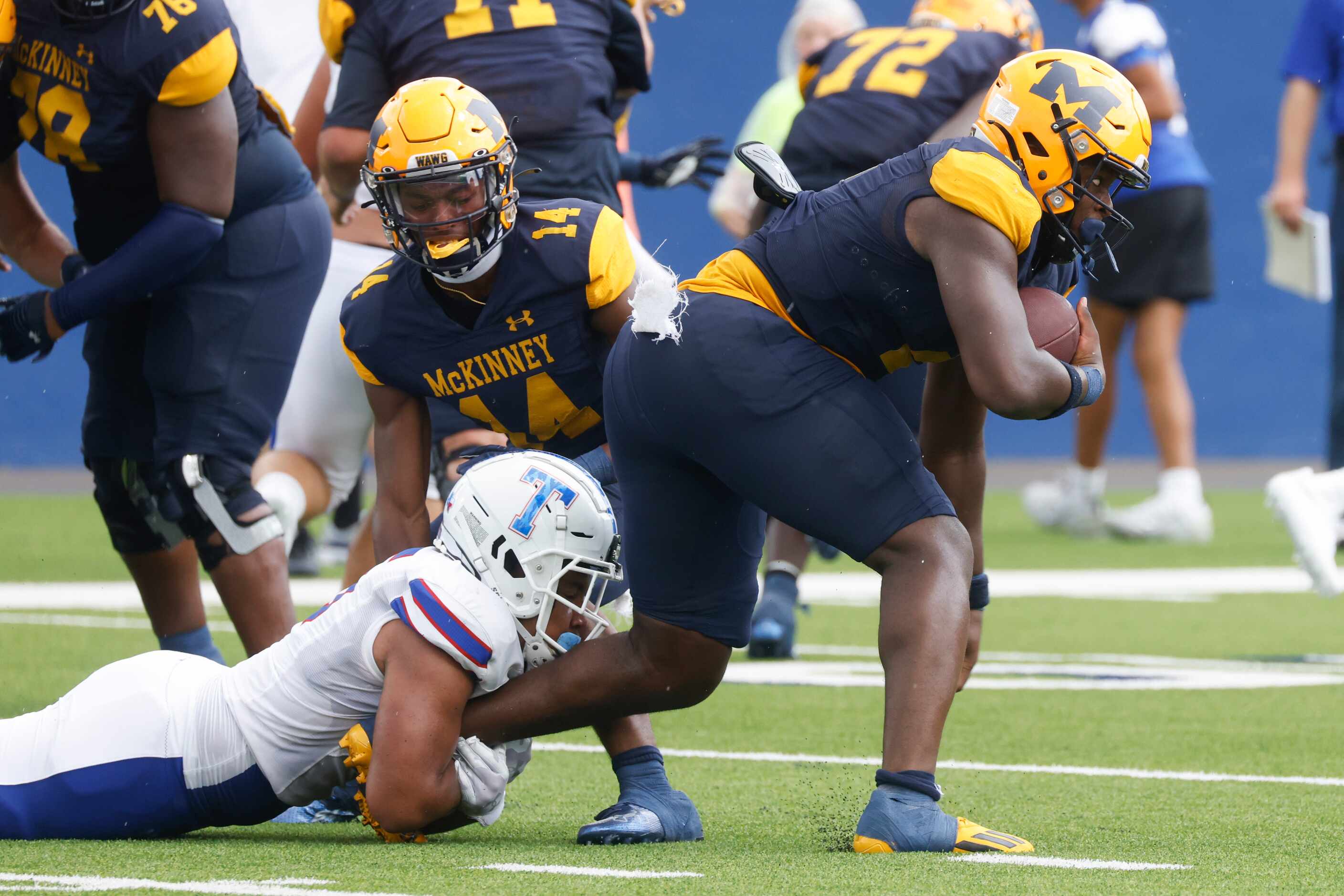 McKinney High’s Bryan Jackson (2), right, gets tackled against Temple High during a...