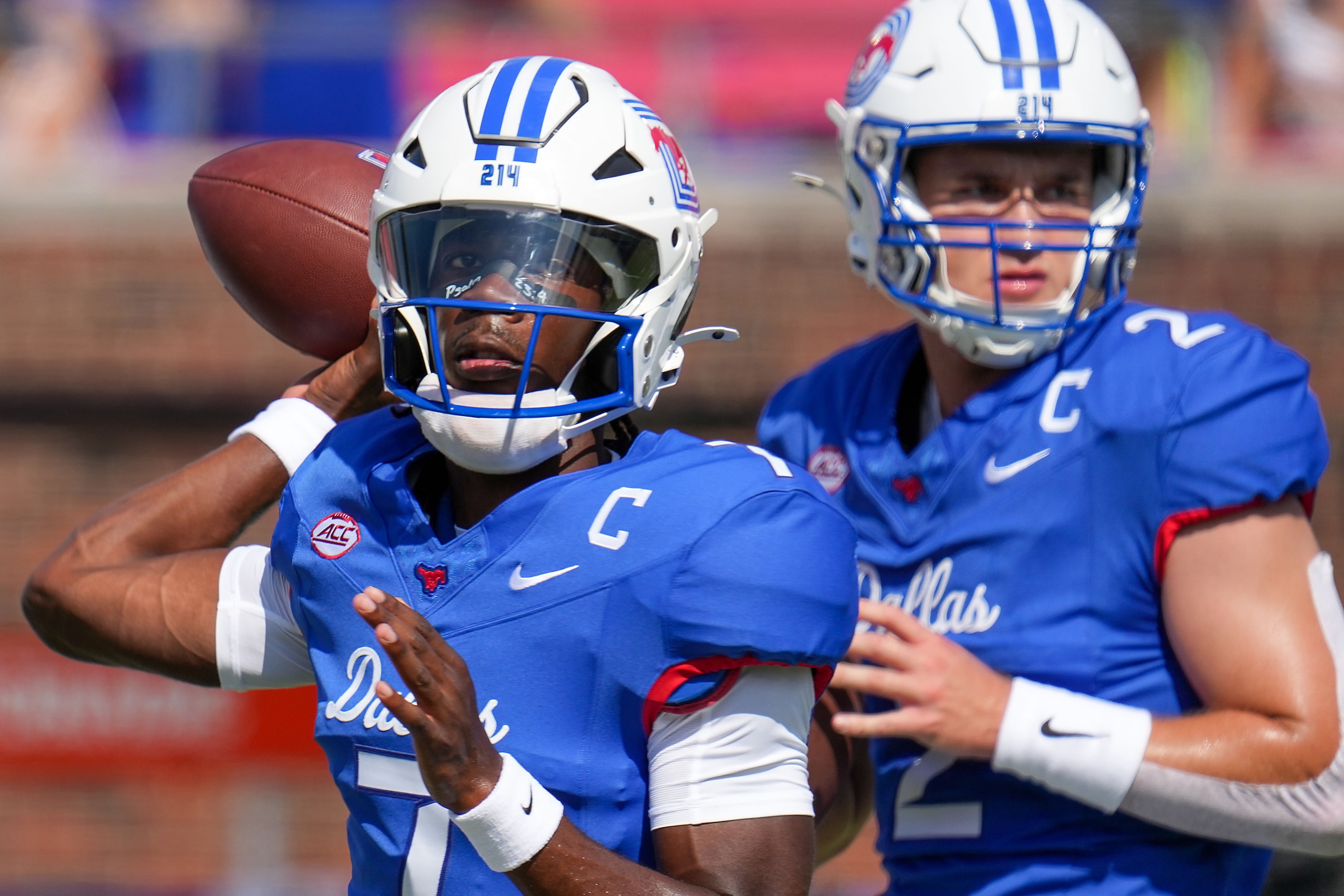 SMU quarterbacks Kevin Jennings (7) and Preston Stone (2)  warm up before an NCAA football...