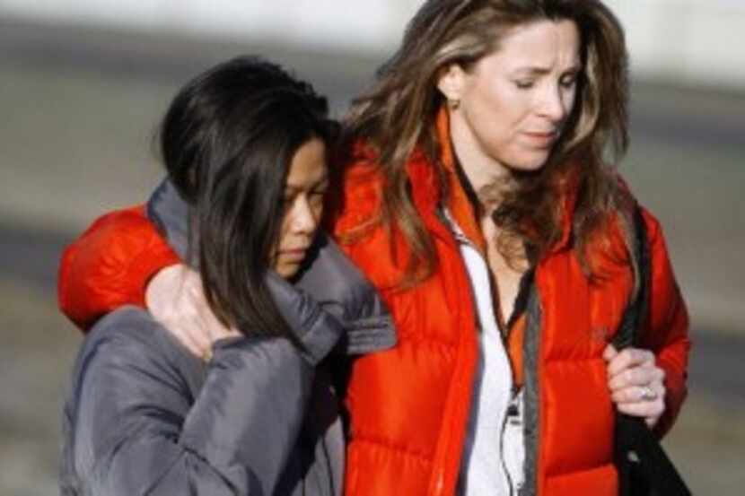  FILE PHOTO: Karen James, right, wife of Kelly James, and Michaela Cooke, (left) wife of...
