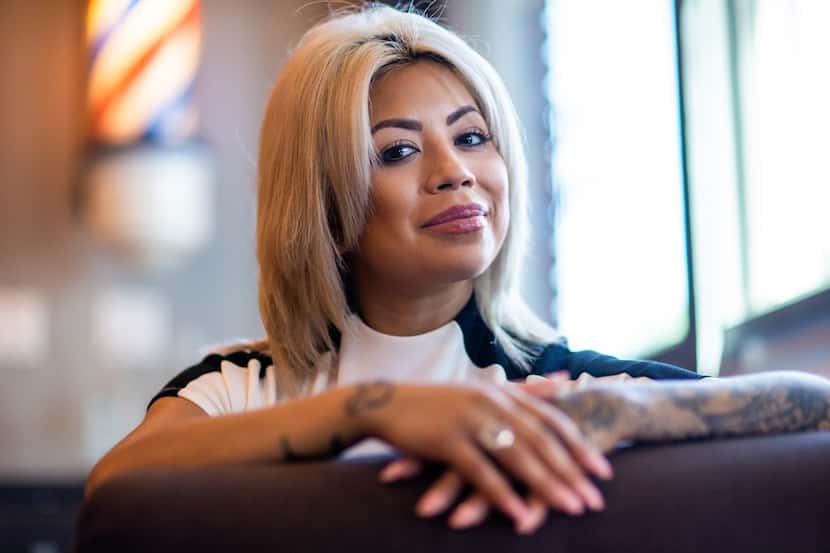 Lilly Benitez, the owner and founder of Blade Craft Barber Academy, poses for a portrait at...