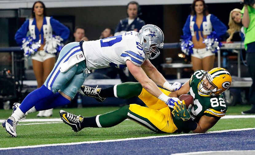 Green Bay Packers tight end Richard Rodgers (82) scores a touchdown as he's tackled by...