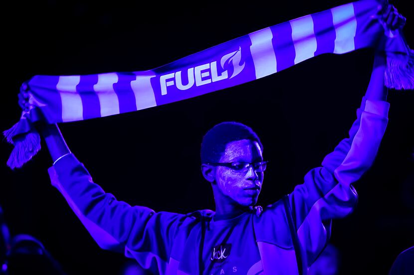 Dallas Fuel fans cheer their team before the start of a Overwatch League match against the...