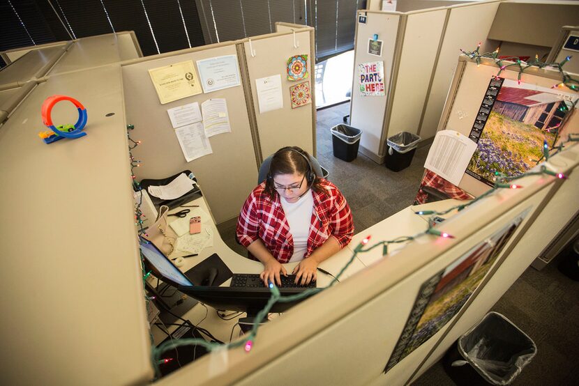 Intake specialist Kristin Macko worked to finish documenting a recent report to the hotline....