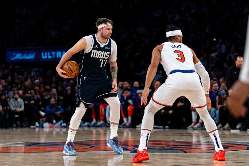 Dallas Mavericks guard Luka Doncic (77) is defended by New York Knicks guard Josh Hart (3)...