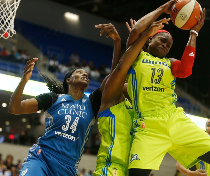Dallas Wings guard Karima Christmas (13) and Dallas Wings center Courtney Paris (3) jump for...