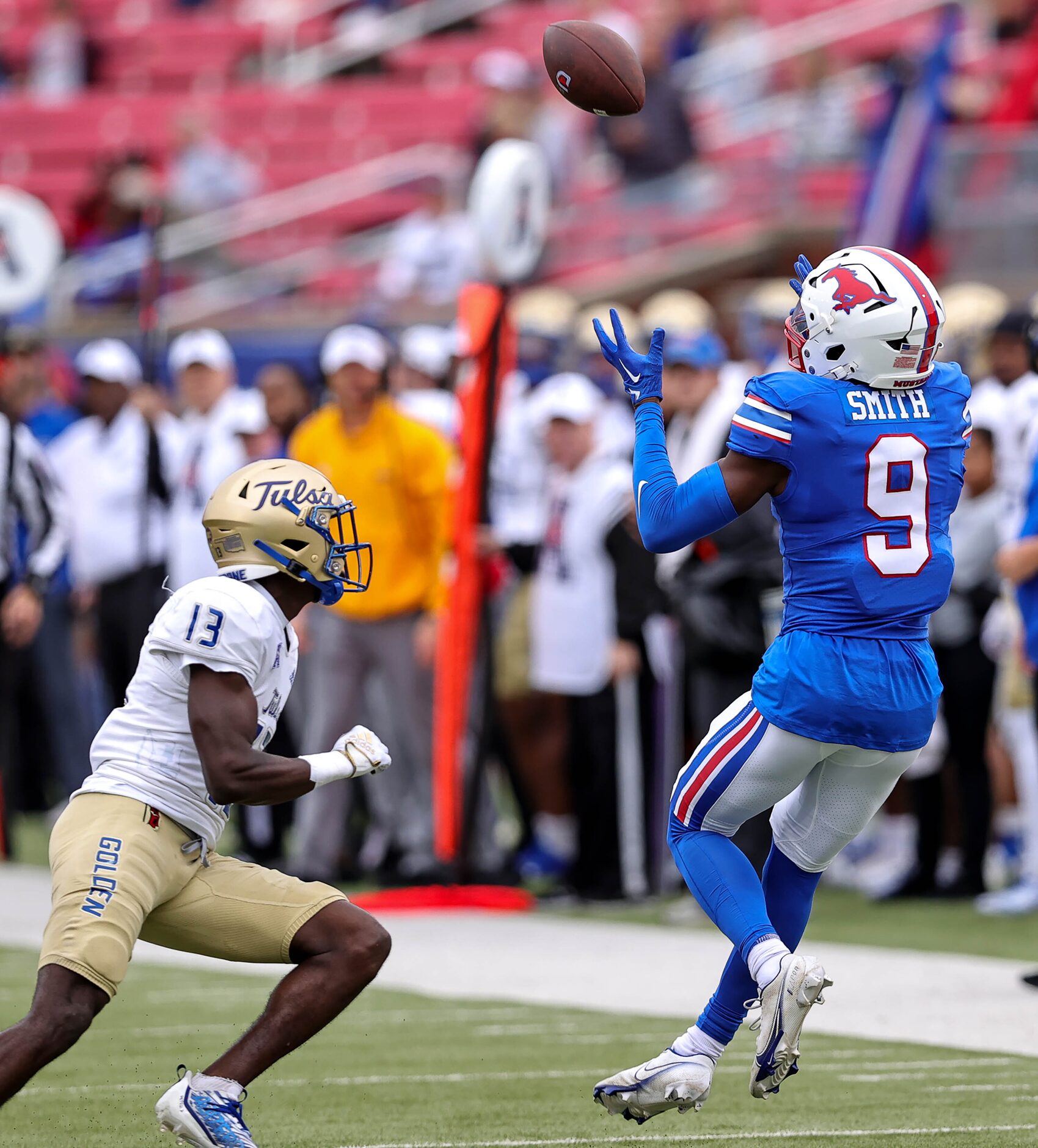 SMU wide receiver Key'Shawn Smith (9) comes up with a reception against Tulsa cornerback...