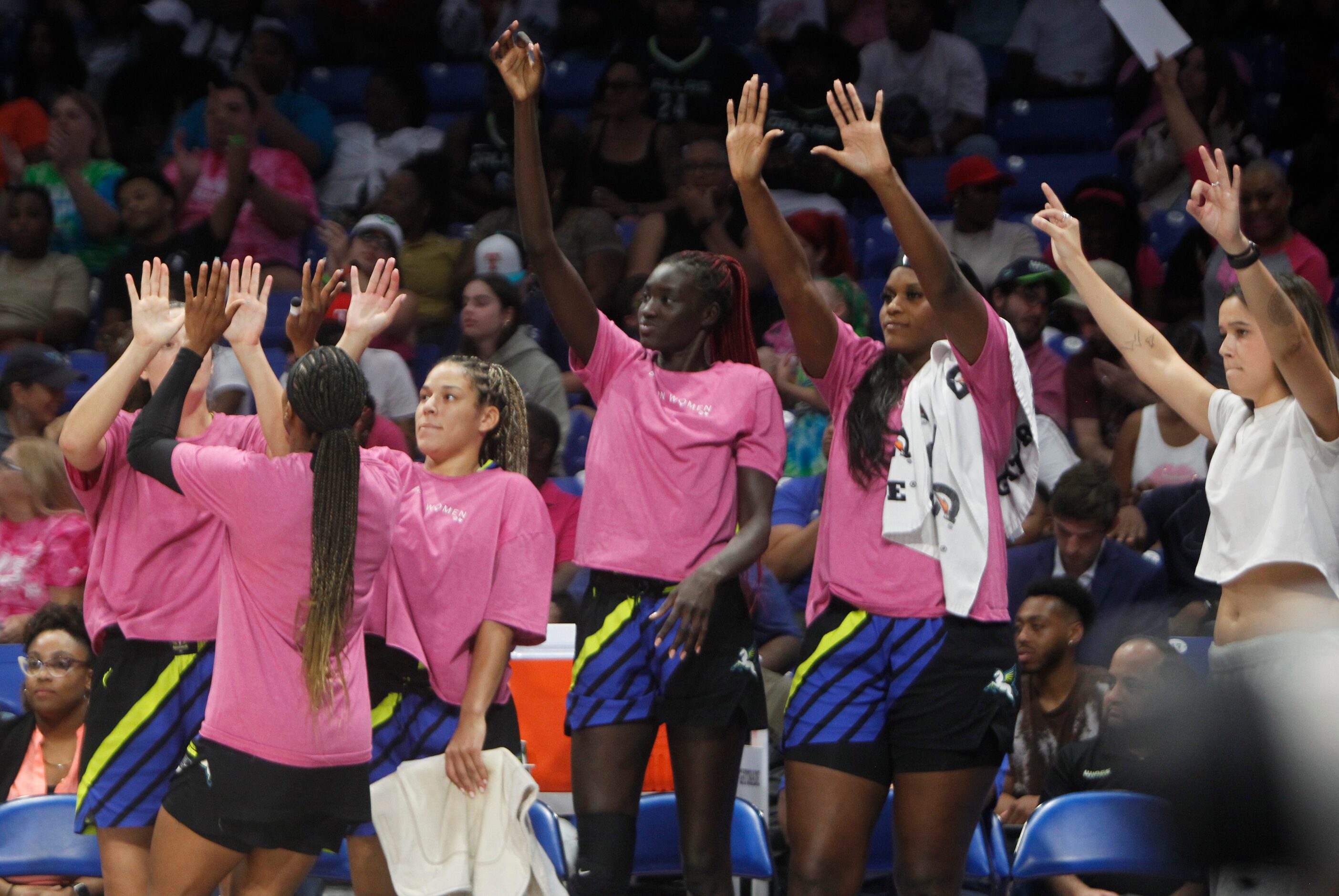 Dallas Wings players react after a second half score in their 91-81 victory over Connecticut...