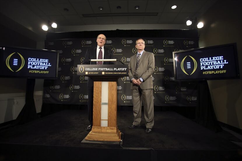 College Football Executive Director Bill Hancock (left) and Jeff Long, Chairman of College...