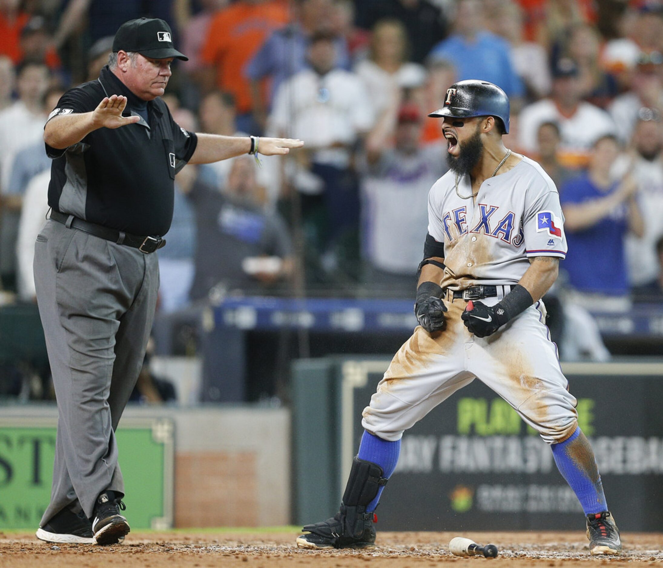 HOUSTON, TX - JULY 28:  Rougned Odor #12 of the Texas Rangers celebrates after hitting an...