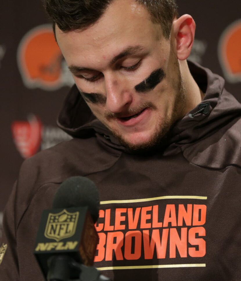 Cleveland Browns quarterback Johnny Manziel speaks with media members following the team's...