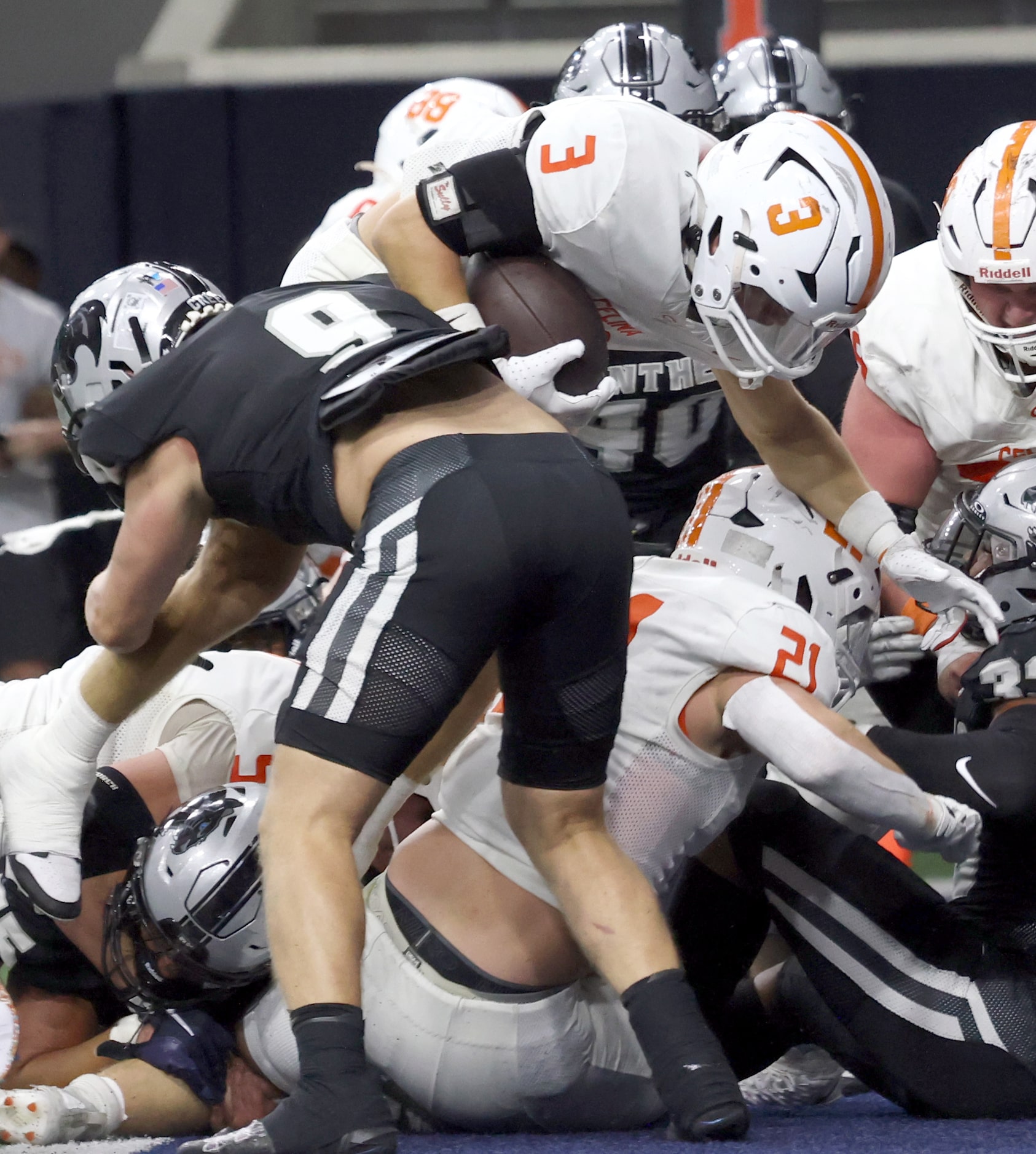 Celina running back Logan Gutierrez (3) dives over the top and beyond the attempted tackle...