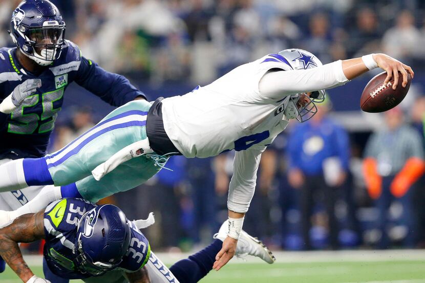 Cowboys quarterback Dak Prescott (4) dives for a would be fourth quarter touchdown in their...